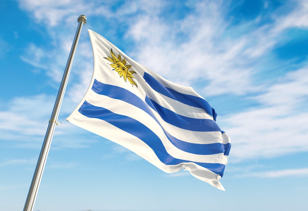 Uruguay,Flag,Waving,In,The,Wind,On,Flagpole.,Perspective,Wiev